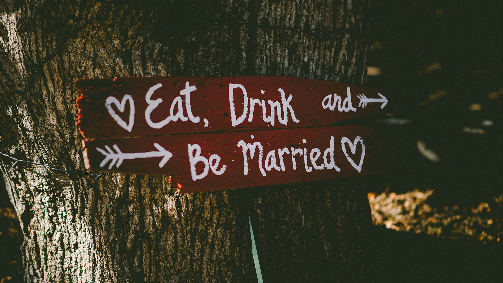 Wedding entertainment sign that reads "Eat, Drink, and be Married."