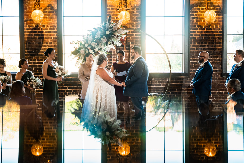 Glover-park-brewery-wedding-photos-48-of-74 Couple standing at the altar during their wedding ceremony at Glover Park Brewery.